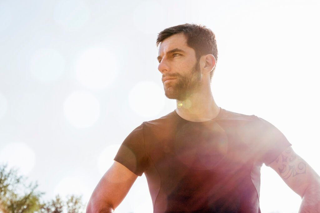 portrait of mid adult man, outdoors, looking away