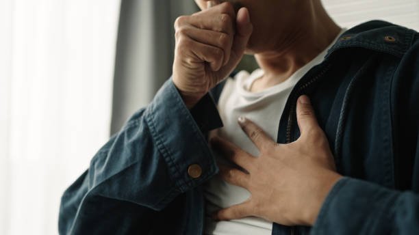 young asian man was suffering from painful chest pain from a chronic disease. young asian man was suffering from painful chest pain from a chronic disease.