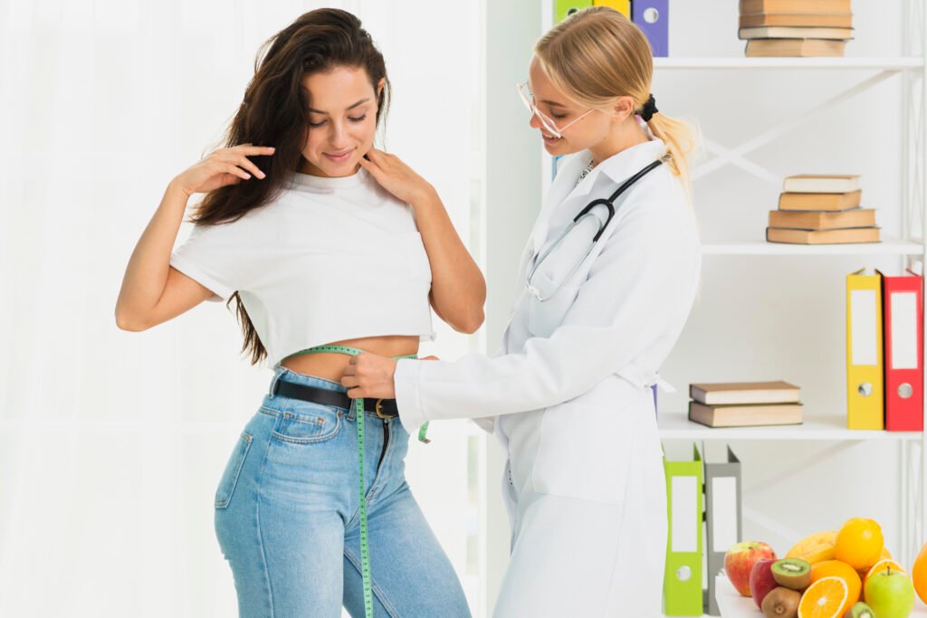 medium shot nutritionist measuring patient